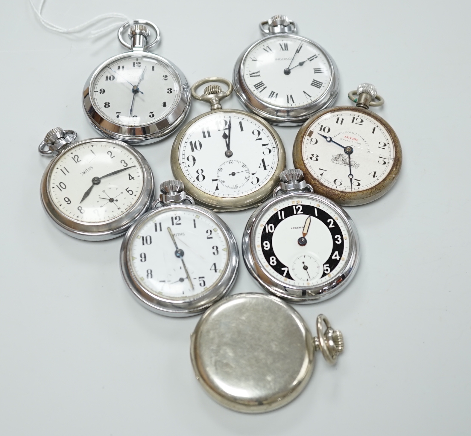 Eight assorted chrome or nickel cased pocket watches, including three Smiths, two Ingersoll, one Record and two others.